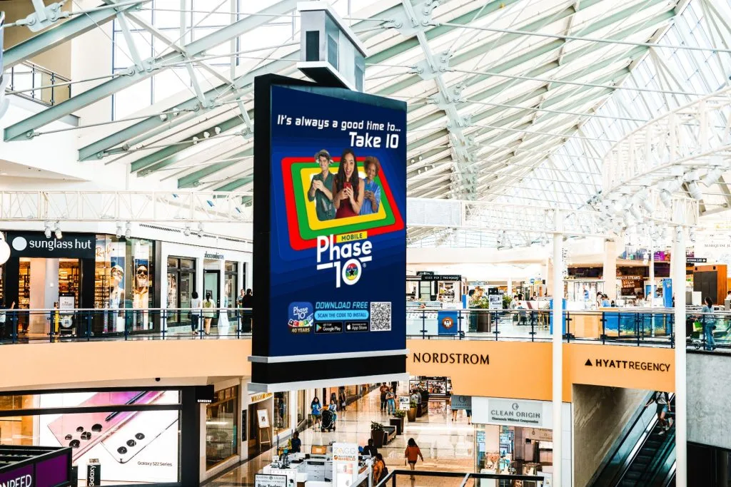 Digital Phase 10 app advertisement inside Stonebriar Centre