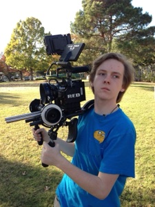 Nick Williamson with a cinema camera in high school